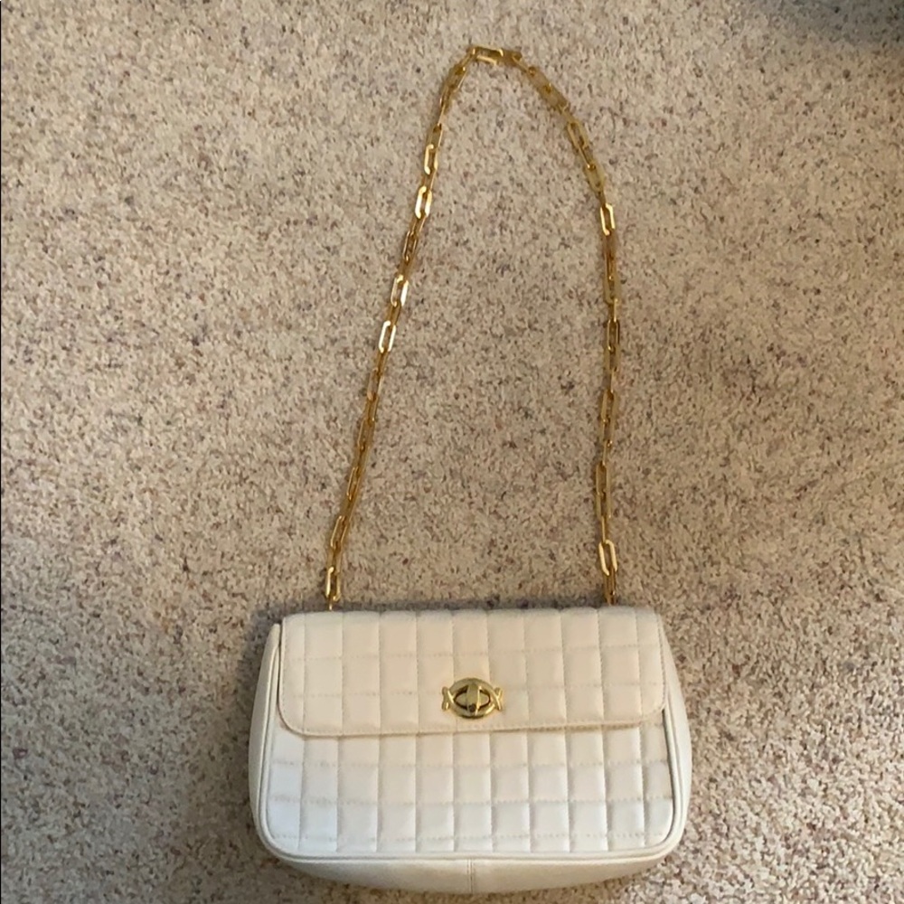 White purse with gold chain